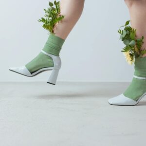 Flowers Inside of a Persons Green Socks